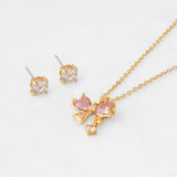 Collar bañado en oro con lazo y zircón rosa