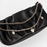 Cartera negra con correa trenzada