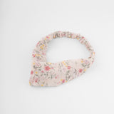 Vincha floral en tono crema