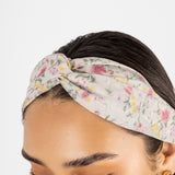 Vincha floral en tono crema