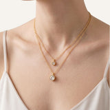 Collar dorado con piedra de zircón