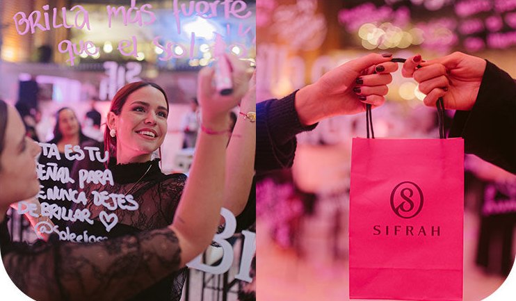 Clientas de Sifrah escribiendo mensajes en un espejo durante un evento Experiencia Sifrah